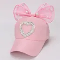 Pink girls' baseball cap with pearl heart design and a large lace bow decoration - Kids (2-8 Years/47-53CM) / Pink