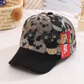 Close-up of jacquard woven cat and koala cartoon patterns on a kids' baseball cap - Kids 2-6 Years (52-57cm) / Black