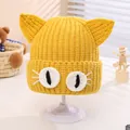 Handmade yellow knit hat for kids featuring cute 3D cat ears and white eye details - Toddler Size (Elastic) / Yellow