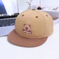 Detail of a color-block snapback hat with a 3D silicone capybara patch and air vents - Kids / Khaki