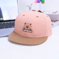 Detailed view of pink and brown capybara cartoon patch on flat brim baseball cap - Kids 3-8Y (50-54CM) / Pink