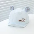 Close-up of light blue baby baseball hat featuring cute bear ears and heart embroidery - Infant One Size / Sky Blue