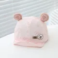 Close-up of pink baby baseball cap with 3D bear ears and gold heart embroidery detail - Infant One Size / Pink