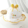 Detailed close-up of baby sun hat with lace embroidery, yellow bow, and bunny ears - 1-3 Years / Yellow
