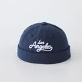 Close-up of Los Angeles white embroidery on the navy blue cotton baby docker hat - 50cm / Dark Blue