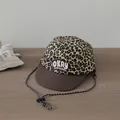 Kids baseball hat featuring leopard print design and brown brim with adjustable chin strap - OKAY Embroidery Style / Dark Coffee Brim