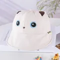 Detail of cream baby sun hat with cute cat ears and embroidered blue eyes feature - 48-50cm / Cat White