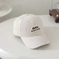 Kids cream baseball cap featuring dark brown BAD BUSINESS 3D embroidery on front - 50-54cm / White