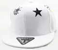 Detail of white kids baseball cap featuring black star embroidery and flat brim style - Children (3-8 Years Old) / White