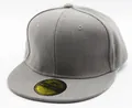 Close-up of dark grey snapback cap showing twill fabric texture and golden peak sticker - Adult Grey