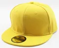 Close-up of bright yellow snapback baseball cap with a decorative gold brim sticker - Adults Yellow