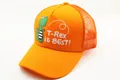 Detail of orange mesh trucker hat for kids featuring a green T-Rex cartoon and embroidery - Kids (2-7 Years) / Solid Orange