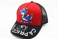Close-up of kids mesh baseball cap with red front, dinosaur print, and mesh back - Kids (2-7 Years) / Pink and Grey Colorblock