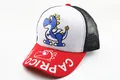 Detail of kids mesh trucker hat with cute blue dinosaur print and Capricorn text - Kids (2-7 Years) / Mixed White