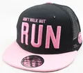 Detail of black and pink snapback trucker hat with embroidered slogan and mesh back - Adult / Pink Brim + Black