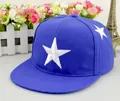 Close-up of white star embroidery on navy blue flat brim snapback baseball cap - Adult / Sapphire Blue