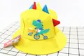 Detailed view of yellow kids dinosaur bucket hat with 3D colorful spines and cartoon print - Kids (2-6 Years) / Yellow