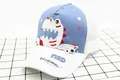 Detail of a kids baseball cap with blue dinosaur embroidery and breathable white mesh - Kids (3-8 Years) / White