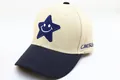 Detail of blue pentagram and smiley face embroidery on a cotton baseball cap for kids - Kids (2-8 Years) / Star Smile Khaki
