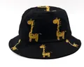 Kids black foldable sun hat featuring cute yellow giraffe patterns in cotton twill - Kids (2-7 Years) / Black