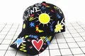 Detail of kids baseball cap with colorful sunshine graffiti and vibrant street art patterns - Kids (3-12 Years) / Black with Sun Embroidery