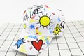 Detailed view of kids white cotton baseball cap featuring colorful graffiti and sunshine text - Kids (3-12 Years) / Sun White