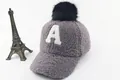 Detail of grey plush kids' winter baseball cap with white A embroidery and black pompom - Children (3-8 Years Old) / A Marker Gray