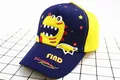 Detailed embroidery of a cartoon dinosaur and red stars on a child's baseball cap - Children (2-8 Years Old) / Navy Yellow Patchwork