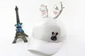 Detail of white kids baseball cap featuring sequin bunny ears and pink bow decoration - Summer Mesh Style (White)