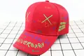 Detail shot of a red kids' baseball cap featuring colorful graffiti and street dance patterns - Kids / Double Cross Red
