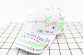 Detail of white cotton baseball cap with colorful street style graffiti and city names - Kids / Double Cross White