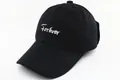 Detail of the high-quality white Forever embroidery on this black cotton baseball cap - Kids Size / Black