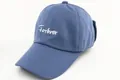 Detail of light blue cotton baseball cap featuring white Forever script embroidery - Kids Size / Blue