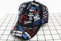 Detail of a black baseball cap with vibrant graffiti letters and street style print - Kids / FD Black