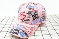 Detail view of pink cotton baseball cap with colorful graffiti print and street style text - Kids / FD Pink