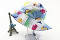 Detail of blue sun hat for kids featuring ocean fish prints and adjustable chin strap - Light Blue Sea Creatures Style (Fig 11)