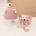 Close-up of knit baby hat and matching crossbody bag with cute teddy bear ornaments - Hat and Bag Set / Pink