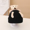 Chic black knitted baby beanie featuring a cute beige teddy bear plush decoration - Hat / Black