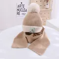 Detail of children's knit hat and scarf set with avocado embroidery and soft pompom - Kids approx 3-10 years / Khaki