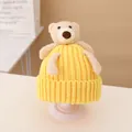 Bright yellow knitted children's hat featuring a cute plush bear decoration - Hat / Yellow