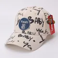 Cappellino da baseball per bambini bianco crema con graffiti neri e toppa peace blu - Bambini (circa 3-10 anni) / Beige