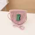 Pink knit toddler crossbody bag featuring a green handmade dinosaur crochet pattern - Knitted Crossbody Bag / Pink