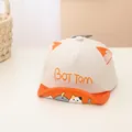 Detailed close-up of soft-brim baby baseball cap with cute cartoon cat and pig patterns - Infant 0-30 Months / Off White