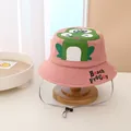 Detailed view of pink cotton sun hat with cartoon frog embroidery and windproof strap - Kids / Pink