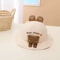 Detail of baby sun hat featuring plush brown bear ornament and Bear Hoase embroidery - Baby (Approx 1-4 Years Old) / Beige Rabbit