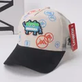 Detail of kids trucker hat featuring 3D pixel robot patch and breathable white mesh back - Kids (Approx. 2-8 Years) / Beige