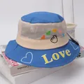 Detail of children's mesh sun hat with Love lettering and breathable heart embroidery - Sapphire Blue