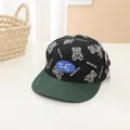 Kids flat brim baseball cap featuring black cartoon bear print and green peak - Black