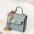 Mini light blue leather handbag charm with gold hardware and floral silk scarf detail - Blue