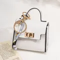 Mini white pebble leather bag charm with gold hardware and decorative floral silk scarf - White